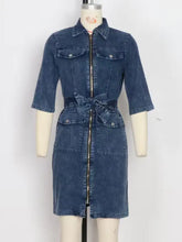 Denim dress with collar, three-quarter sleeves, front zipper closure, and tied waist belt in blue short sleeve denim style